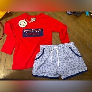 Red and blue swim trunks with smocked America rash guard